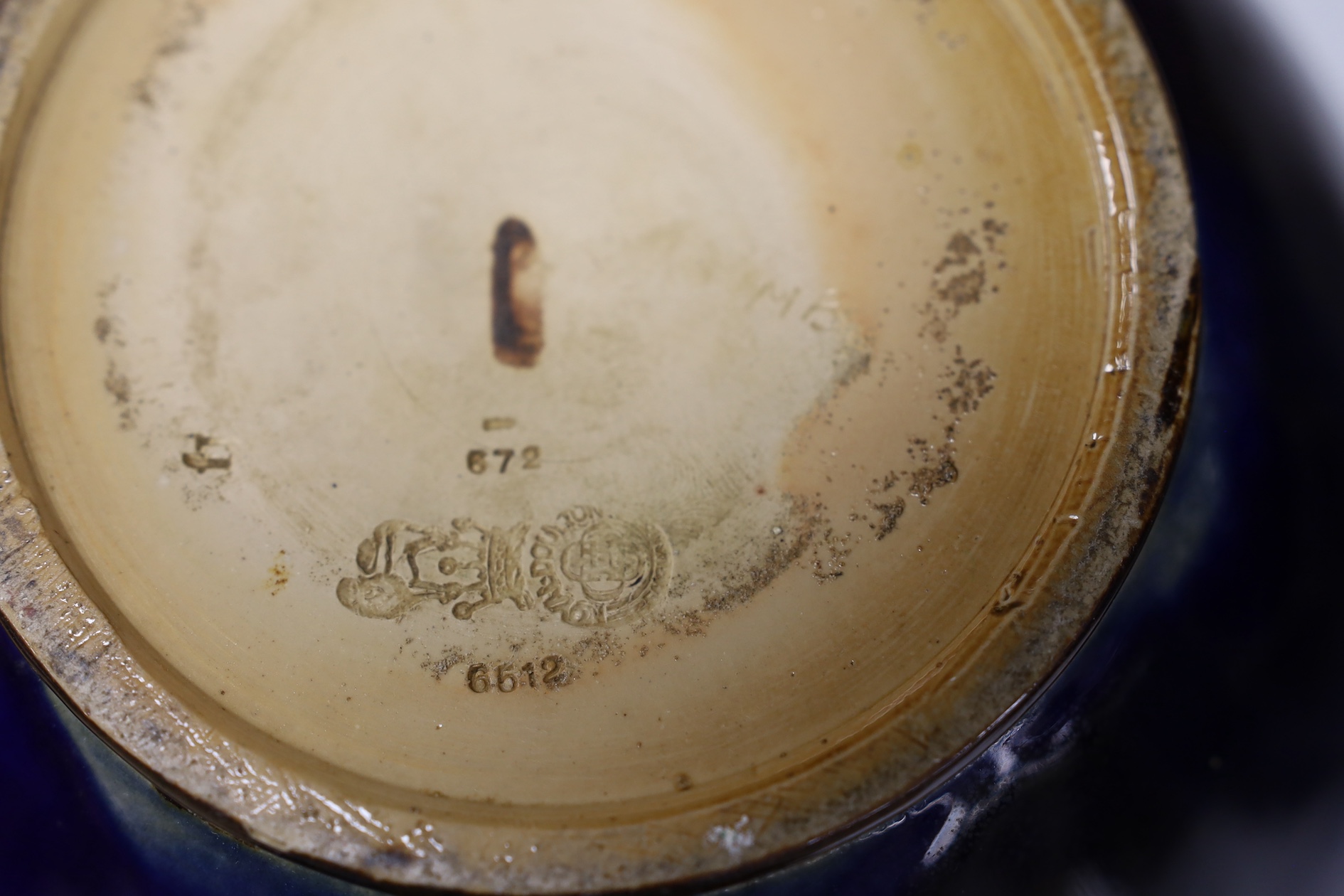 A Royal Doulton blue stoneware jardiniere by Hannah Barlow and another smaller jardiniere by Maude Bowden, largest 29cm in diameter (2). Condition - good